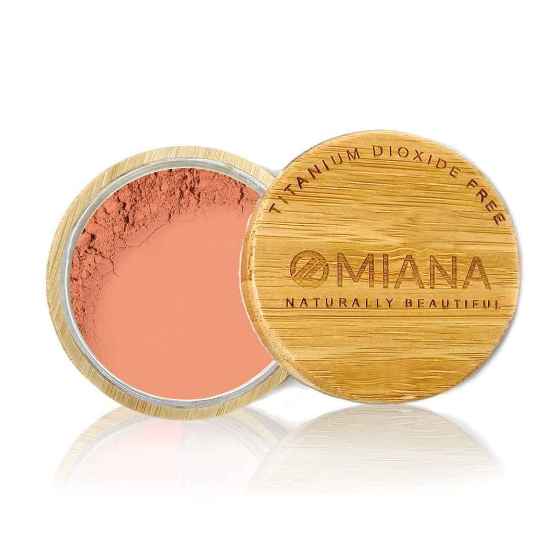 Omiana Loose Powder Mineral Blush Makeup in a bamboo container on a white background